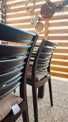 two blue chairs sitting next to each other at MAGNOLIA HOUSE by the RIVER in Metlika