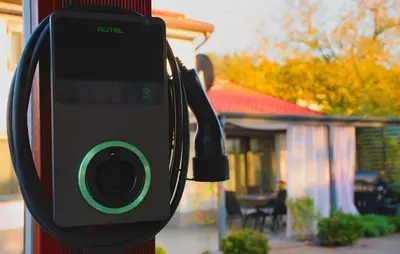 a parking meter attached to a pole in front of a house at 3 Bedroom Awesome Home In Divaca in Divača