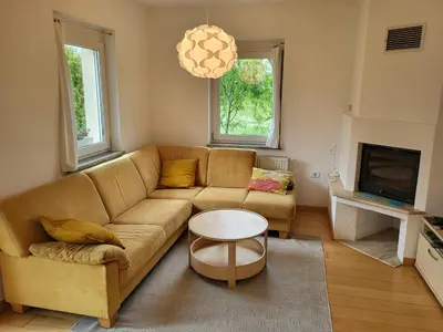 a living room with a couch and a table at APARTMA GONZO in Bovec