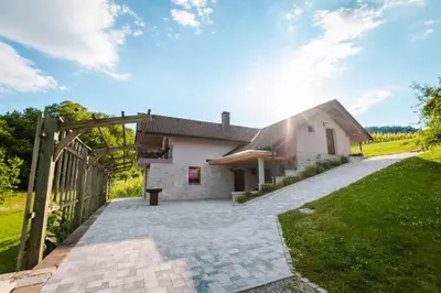 a house with a wooden gate in front of it at Holiday home in Smarjeske Toplice Kranjska Krain 42904 in Smarjeske Toplice