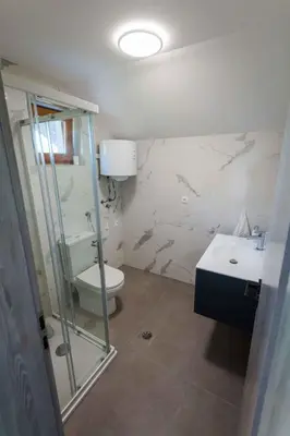 a bathroom with a shower and a toilet and a sink at Holiday home in Smarjeske Toplice Kranjska Krain 42904 in Smarjeske Toplice