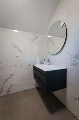 a bathroom with a sink and a mirror on the wall at Holiday home in Smarjeske Toplice Kranjska Krain 42904 in Smarjeske Toplice
