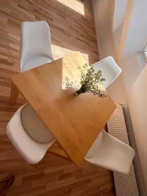 a wooden table with a toilet and flowers on it at Apartment Malina - free private parking in Ljubljana