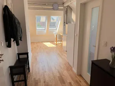 a room with a hallway with a hard wood floor at Apartment Malina - free private parking in Ljubljana