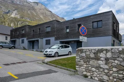 a car parked in a parking lot in front of a building at Apartment Panoramic Bovec in Bovec