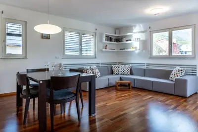 a living room with a couch and a table at Apartment Panoramic Bovec in Bovec
