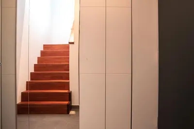 a staircase in a house with a glass door at Apartment Panoramic Bovec in Bovec
