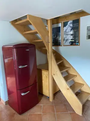 a loft bed with a staircase in a room at Počitniška hiša Mlekarna Grant in Grahovo