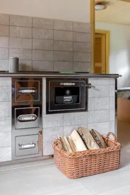 a kitchen with a counter with a basket of bread at Počitniška Hiša Voje in Srednja Vas v Bohinju