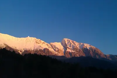 a view of a mountain range with snow on it at Studio Brnat in Kobarid