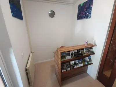 a staircase with a wooden book shelf in a room at Apartment LakeBled with Casle Bled view in Bled