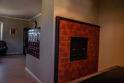a room with a brick wall with a fireplace at Holiday Home Lož in Stari Trg pri Ložu