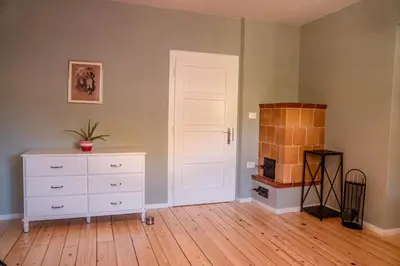 a room with a white dresser and a white door at Holiday Home Lož in Stari Trg pri Ložu