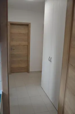 a room with a door and a tiled floor at River Apartment in Bovec