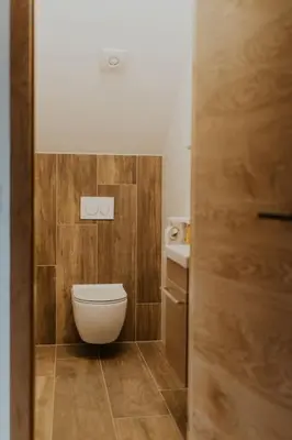 a small bathroom with a toilet and a sink at Haloze na dlani - Haloze in your hand, hiša s pogledom na hribe - a house vith a view of hills in Gruškovec