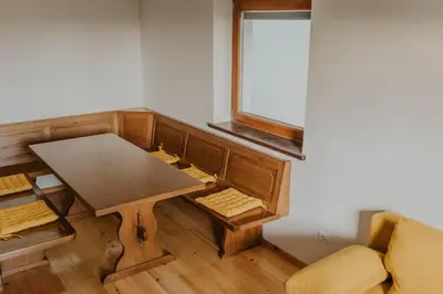 a small room with a table and a couch at Haloze na dlani - Haloze in your hand, hiša s pogledom na hribe - a house vith a view of hills in Gruškovec