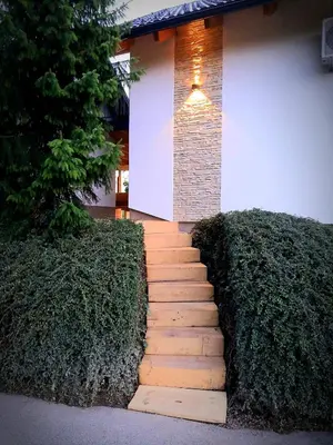 a set of stairs in front of a house at Haloze na dlani - Haloze in your hand, hiša s pogledom na hribe - a house vith a view of hills in Gruškovec