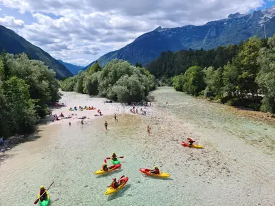 a group of people in kayaks on a river at Apartma Dora Bovec in Bovec