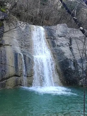 a waterfall on the side of a large rock at Apartma Qbed in Gračišče