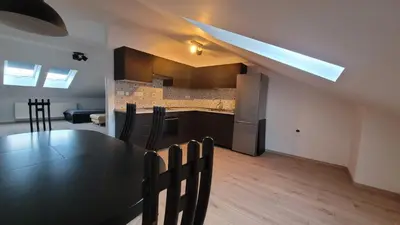 a dining room and kitchen with a table and chairs at Apartma Krupa in Gradac