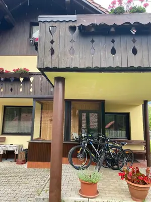 a group of motorcycles parked outside of a building at Apartma Anton in Kranjska Gora