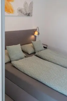 two beds sitting next to each other in a room at Perfect stay 2 in Maribor
