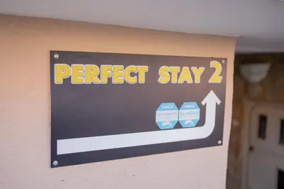 a sign that says perfect stay on a wall at Perfect stay 2 in Maribor