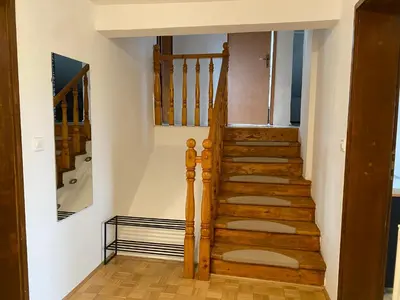 a staircase in a house with wooden floors at Perfect stay 2 in Maribor