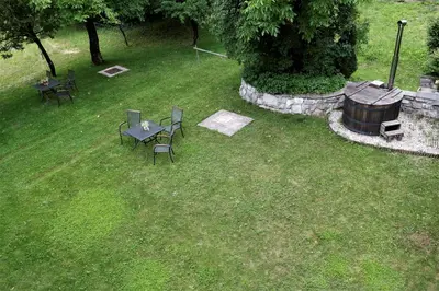 an aerial view of a yard with tables and chairs at GUESTHOUSE Idila pod Nanosom in Senožeče