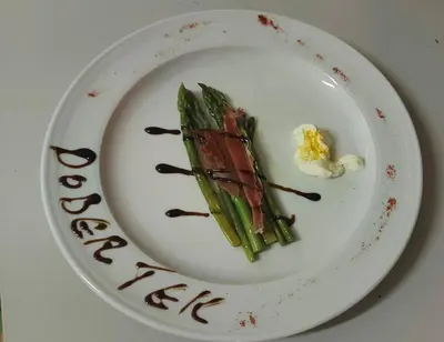 a plate of food with a dessert on it at Tičarjev Dom at Vrsic pass in Soča