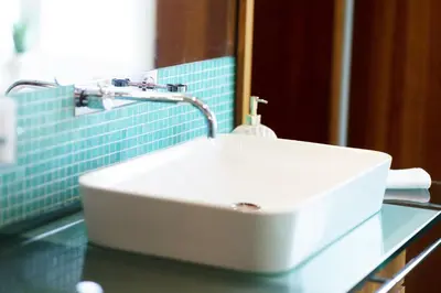 a white sink sitting on a counter in a bathroom at Luxury Apartment Villa Černigoj in Maribor