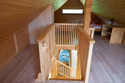 an overhead view of a wooden cabin with a staircase at Hiša Breza in Mozirje