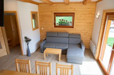 a living room with a couch and a table at Hiša Breza in Mozirje