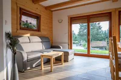 a living room with a couch and a table at Hiša Breza in Mozirje