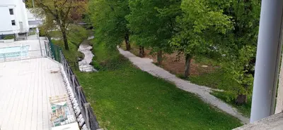 an aerial view of a river with trees and grass at Apartma Rogaska riviera in Rogaška Slatina