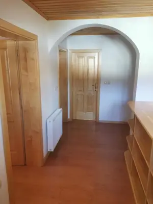 an empty hallway with an archway in a room at Turistična kmetija Ramšak in Zreče