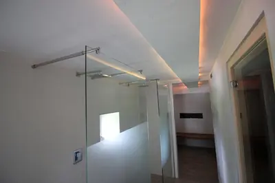 a bathroom with a glass shower in a room at Apartments Pri Jakobu in Kobarid