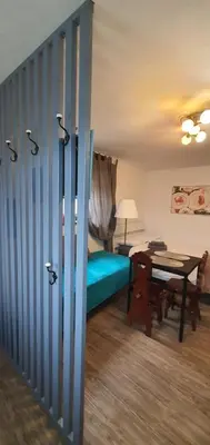 a room with a bed and a table in it at DEKO-rooms in Ljubljana