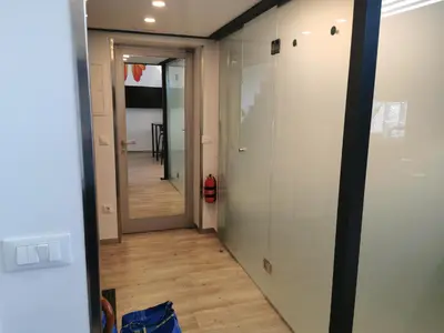 a hallway with a door and a mirror in a room at DREAMY CENTER LOCATION in Ljubljana