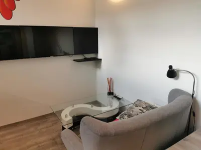 a living room with a couch and a glass table at DREAMY CENTER LOCATION in Ljubljana