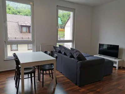 a living room with a couch and a table at Apartma Valan in Bovec
