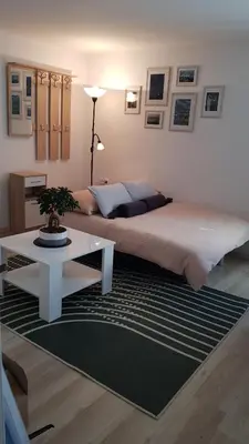 a bedroom with a large bed and a table at Koradinovi - Pod vrtom in Vipava