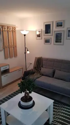 a living room with a couch and a table at Koradinovi - Pod vrtom in Vipava