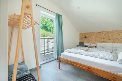 a bedroom with a bunk bed and a window at Holiday Home Lukc with free parking in Kobarid
