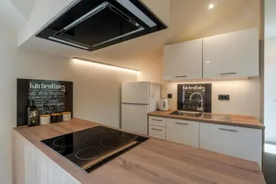 a kitchen with a counter top and a refrigerator at Holiday Home Lukc with free parking in Kobarid