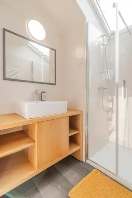 a bathroom with a sink and a shower at Holiday Home Lukc with free parking in Kobarid
