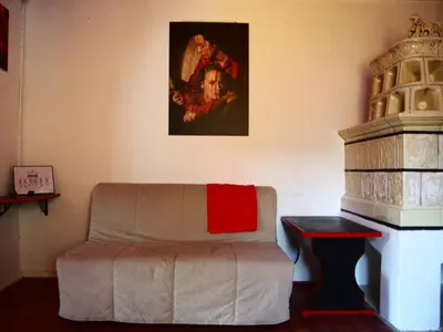 a living room with a couch and a painting on the wall at Tony's Old Farm in Begunje na Gorenjskem