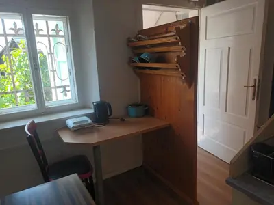 a room with a desk and a window and a door at Tony's Old Farm in Begunje na Gorenjskem
