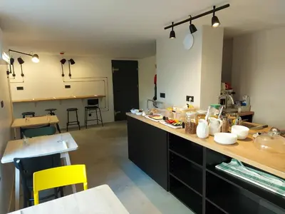 a kitchen with a counter with food on it at Bed & Breakfast Mozaik in Ljubljana