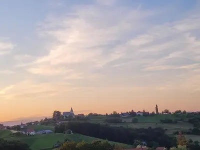a village on a hill at sunset at Holiday house Aronija in Šmarje pri Jelšah